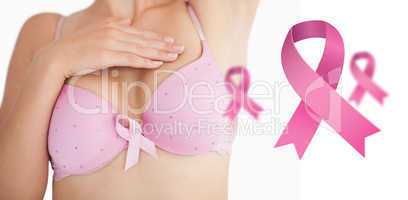 Composite image of woman in bra with breast cancer awareness rib