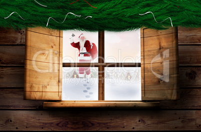 Composite image of santa delivery presents to village