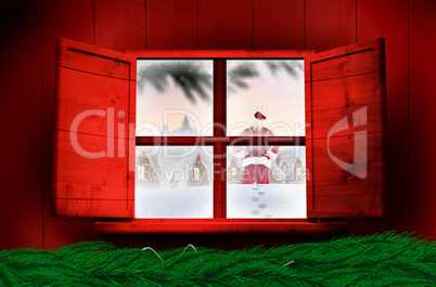 Composite image of santa delivery presents to village