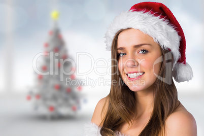 Composite image of sexy santa girl smiling at camera