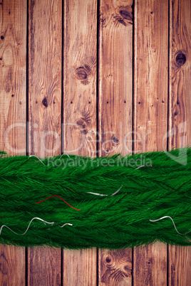 Composite image of fir branch christmas decoration garland