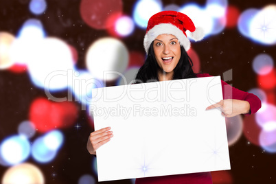 Composite image of woman pointing at white sign