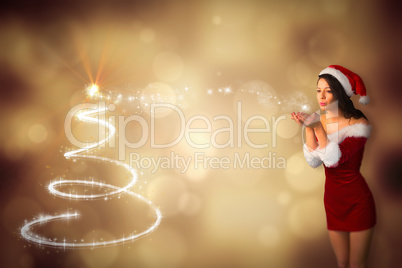 Composite image of pretty girl in santa outfit blowing