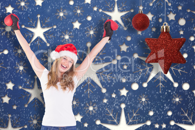 Composite image of festive blonde with boxing gloves