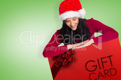 Composite image of woman smiling while looking down