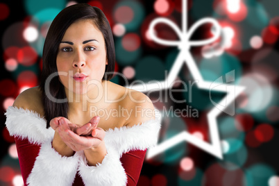Composite image of pretty girl in santa outfit blowing