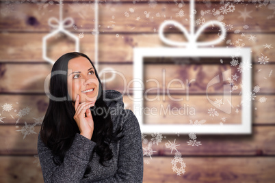 Composite image of smiling woman looking to distance