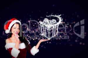 Composite image of pretty girl presenting in santa outfit