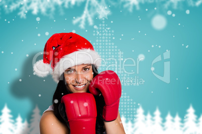 Composite image of woman wearing red boxing gloves