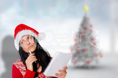 Composite image of woman thinking what to write