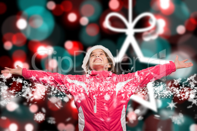 Composite image of cute girl in winter clothes with arms out