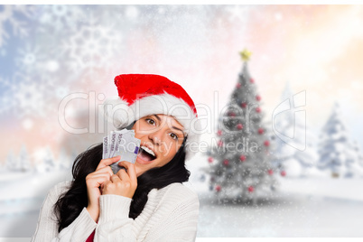 Composite image of woman holding money towards herself