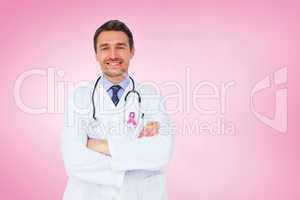 Composite image of handsome young doctor with arms crossed