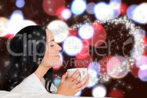 Composite image of woman enjoying a lovely drink