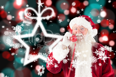 Composite image of santa claus on the phone