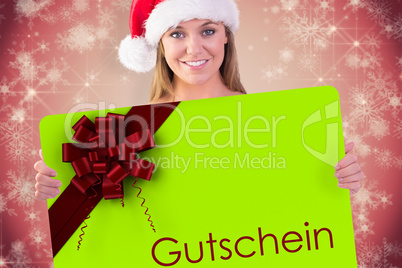 Composite image of festive blonde smiling at camera