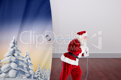 Composite image of santa claus pulling rope