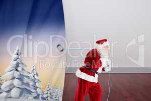 Composite image of santa claus pulling rope