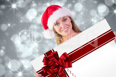 Composite image of festive blonde smiling at camera