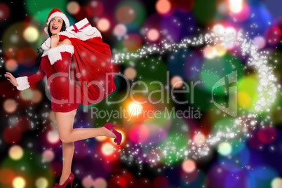 Composite image of woman standing with christmas presents