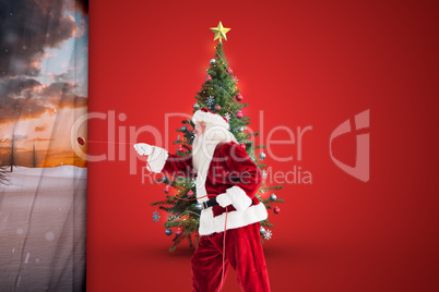 Composite image of santa pulls something with a rope