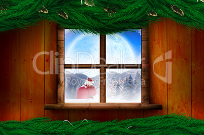 Composite image of santa delivery presents to village