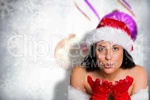 Composite image of woman blowing kiss to camera