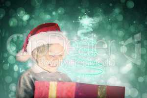 Composite image of festive boy opening gift