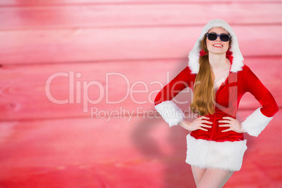 Composite image of cool santa girl wearing sunglasses