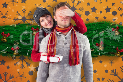 Composite image of smiling woman holding large presents
