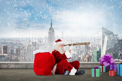 Composite image of santa looking through telescope