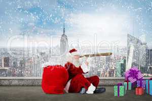 Composite image of santa looking through telescope