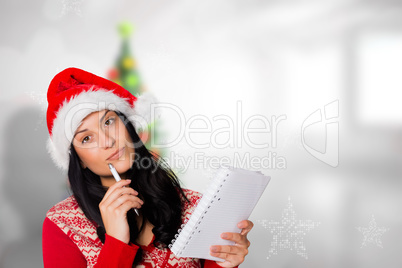 Composite image of woman thinking what to write