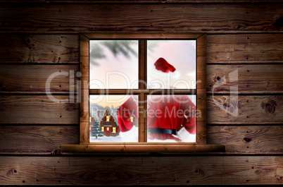 Composite image of santa delivery presents to village