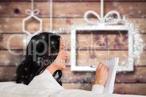 Composite image of woman writing down some notes
