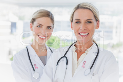 Composite image of blonde doctors standing together