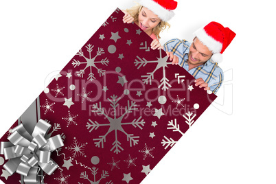 Composite image of young festive couple