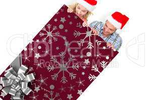 Composite image of young festive couple