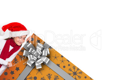 Composite image of festive little girl showing card