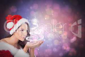 Composite image of pretty girl in santa outfit blowing