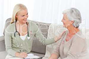 Composite image of doctor talking with her patient