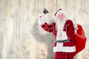 Composite image of santa claus ringing bell