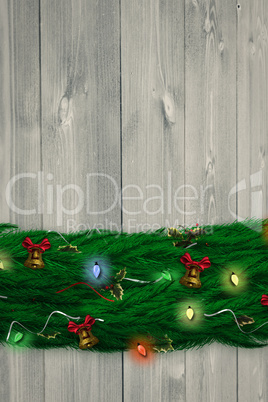 Composite image of fir branch christmas decoration garland