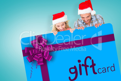 Composite image of young festive couple