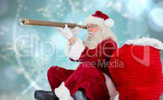 Composite image of santa claus looking through telescope