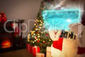 Composite image of santa using futuristic touchscreen