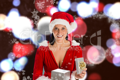 Composite image of smiling woman opening christmas present