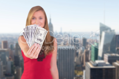 Composite image of pretty blonde showing wad of cash