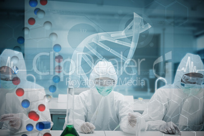 Composite image of chemists working in the lab with futuristic i