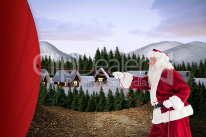 Composite image of santa pulls something with a rope